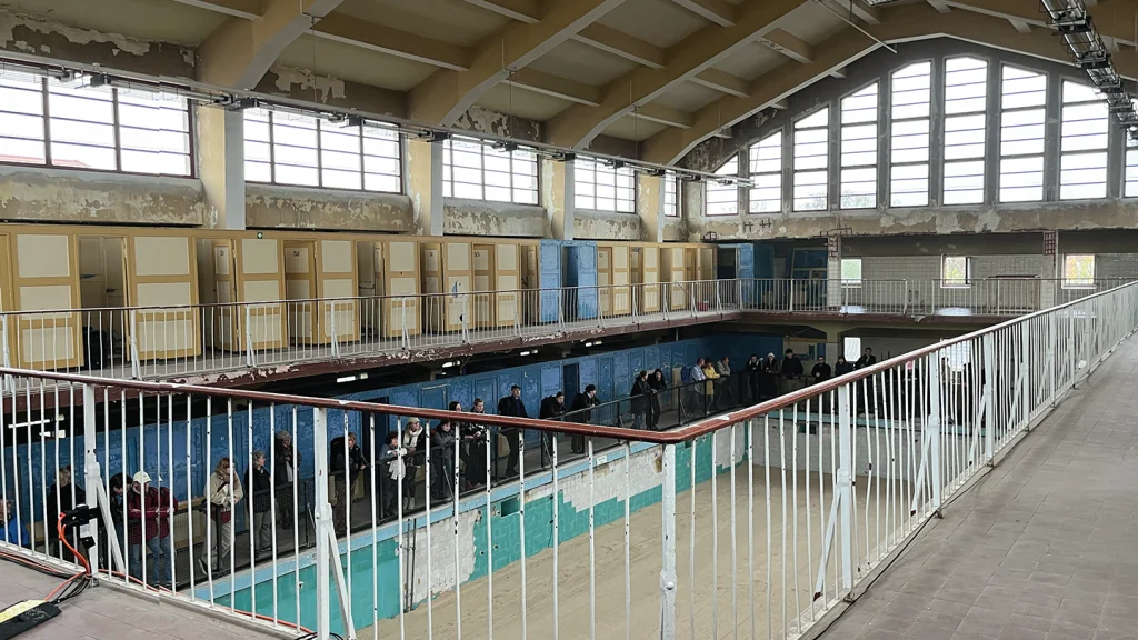 The former early 20th-century power station E-Werk Luckenwalde, rescued from dereliction by artist Pablo Wendel and now a turbine hall exhibition space, here featuring a Kira Freije exhibition; the adjacent 1920s disused municipal swimming pool, the Bauhaus Stadtbad can host anything from community theatre to opera